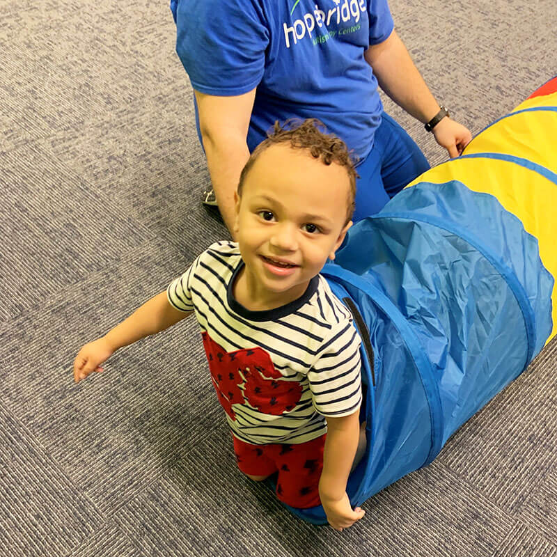 Young boy with autism playing in Hopebridge Center.