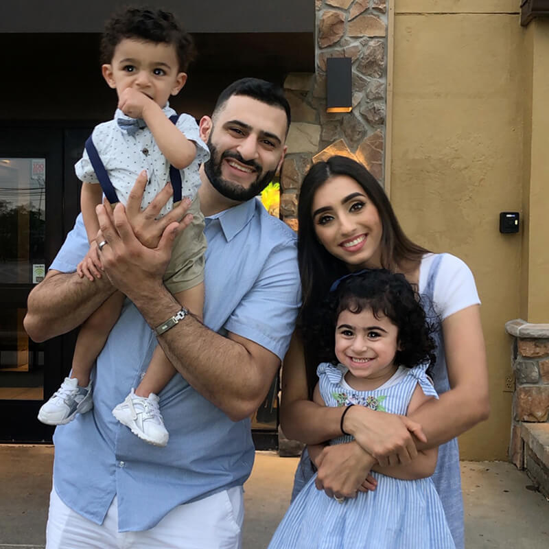 Tasneem, girl with autism, pictured together with her mother, father and brother.