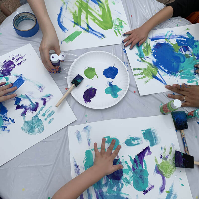 Hopebridge kiddos working on group play through art.