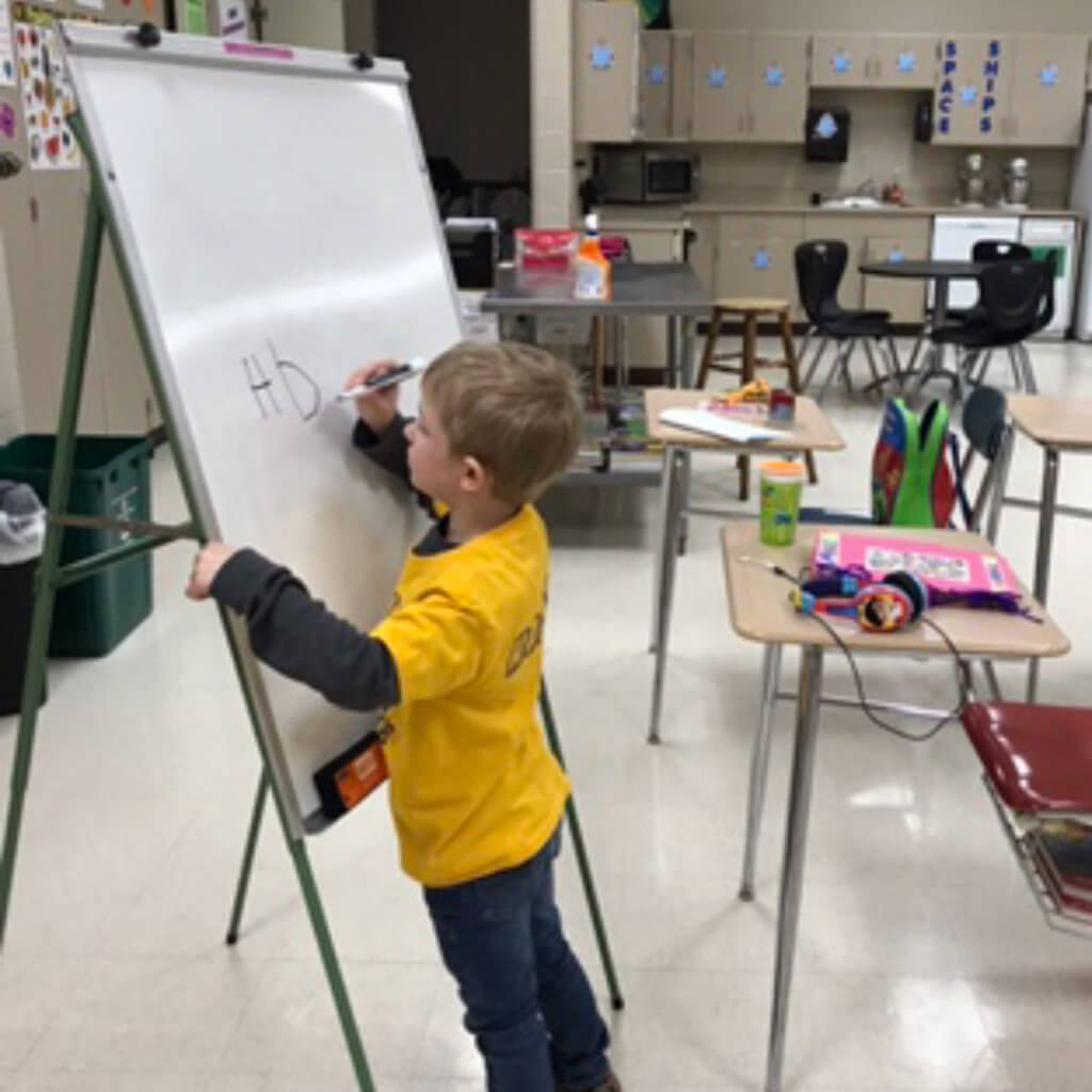 Homer writing letters on the white board