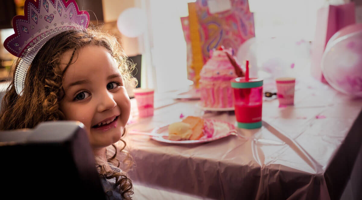 Norah, a young girl with autism, celebrating her birthday