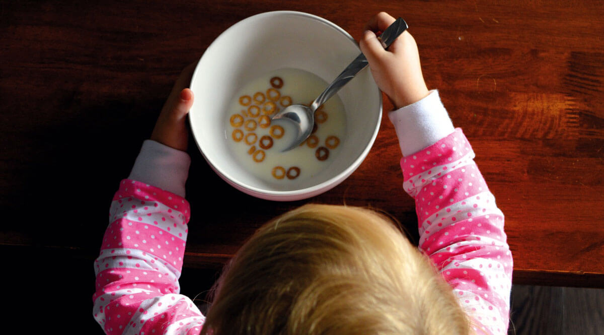 Child with autism eating cereal