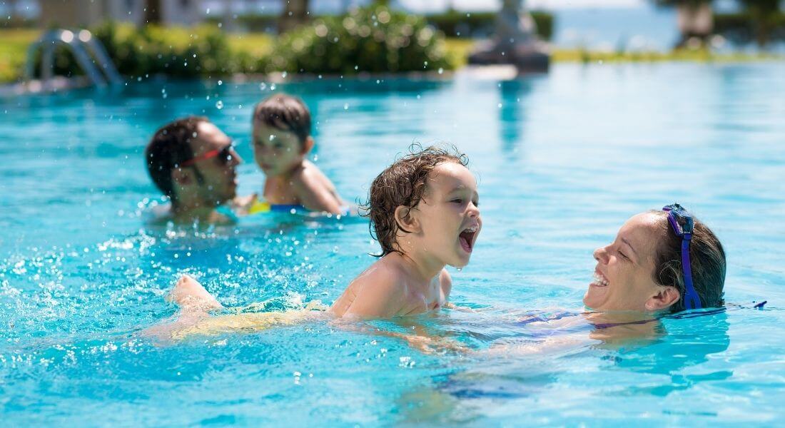 Parents and Child playing in the water