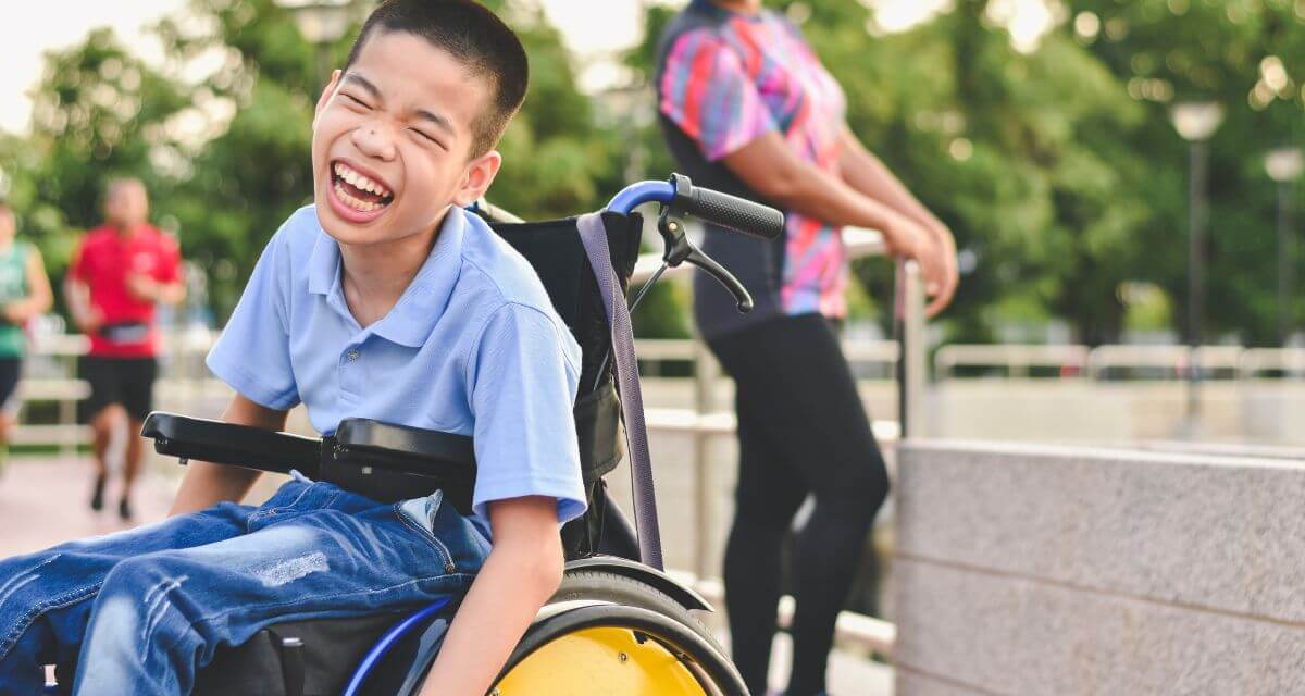 Child with disability enjoying outdoor sports fun event
