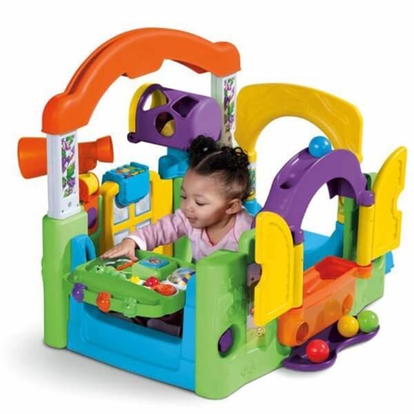 Toddler playing in Little Tikes Activity Garden