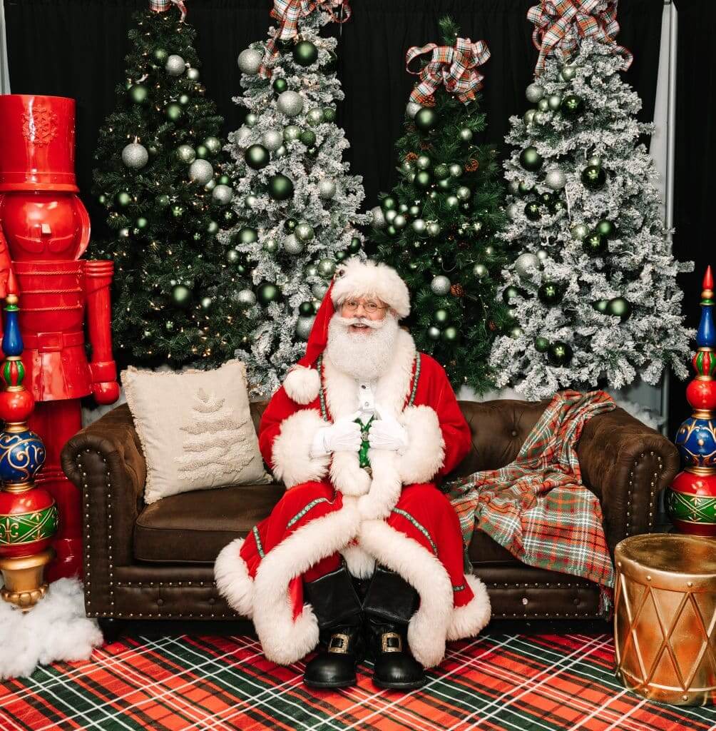 Santa in a holiday setting at the mall for Sensory-Friendly Santa events.