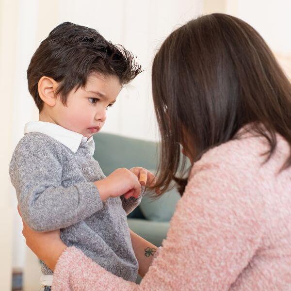 Photo of mom trying to communicate with son who is non-speaking.
